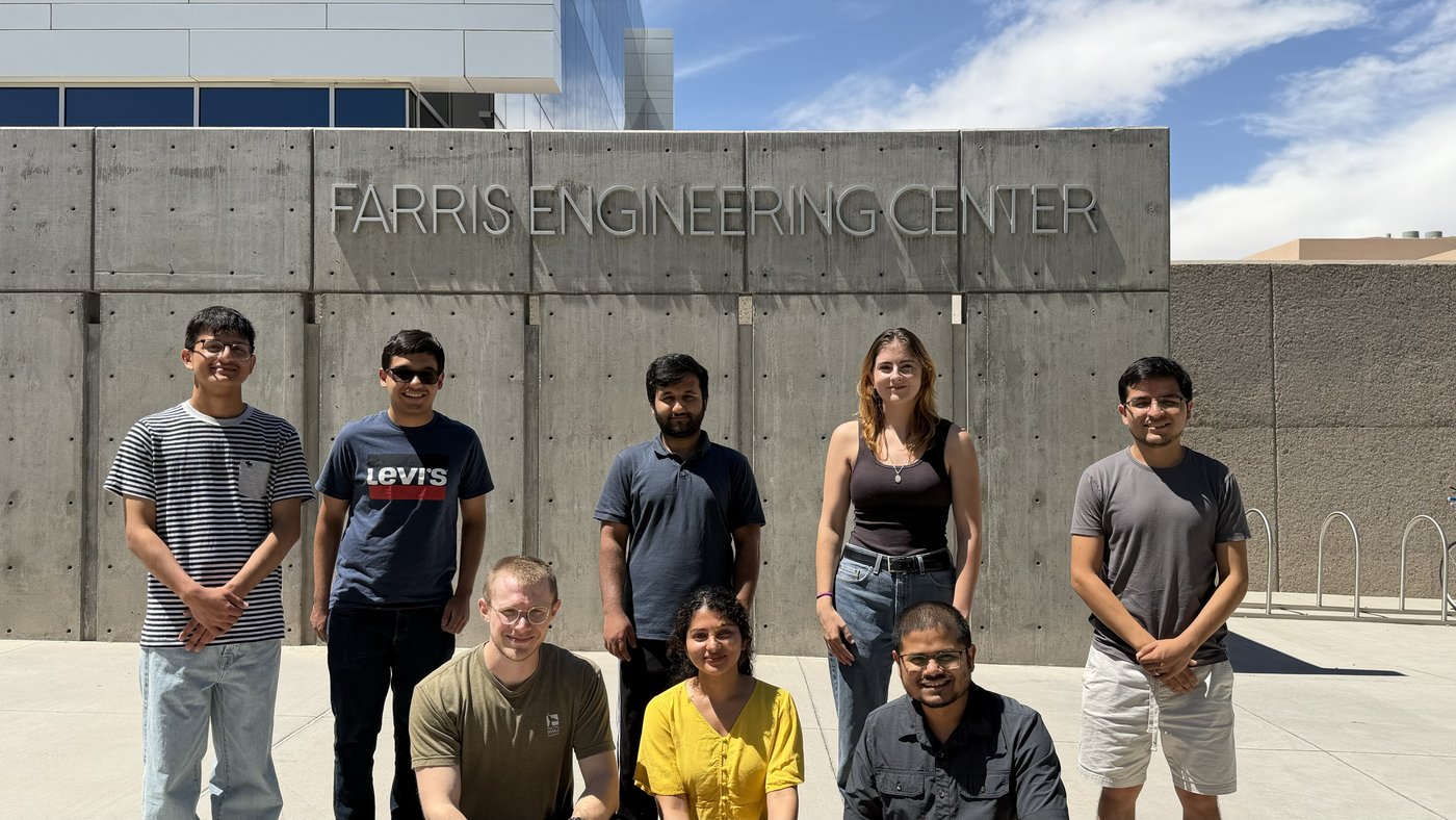Members of the Beyond Defense Lab outside the Farris Engineering Center at the University of New Mexico